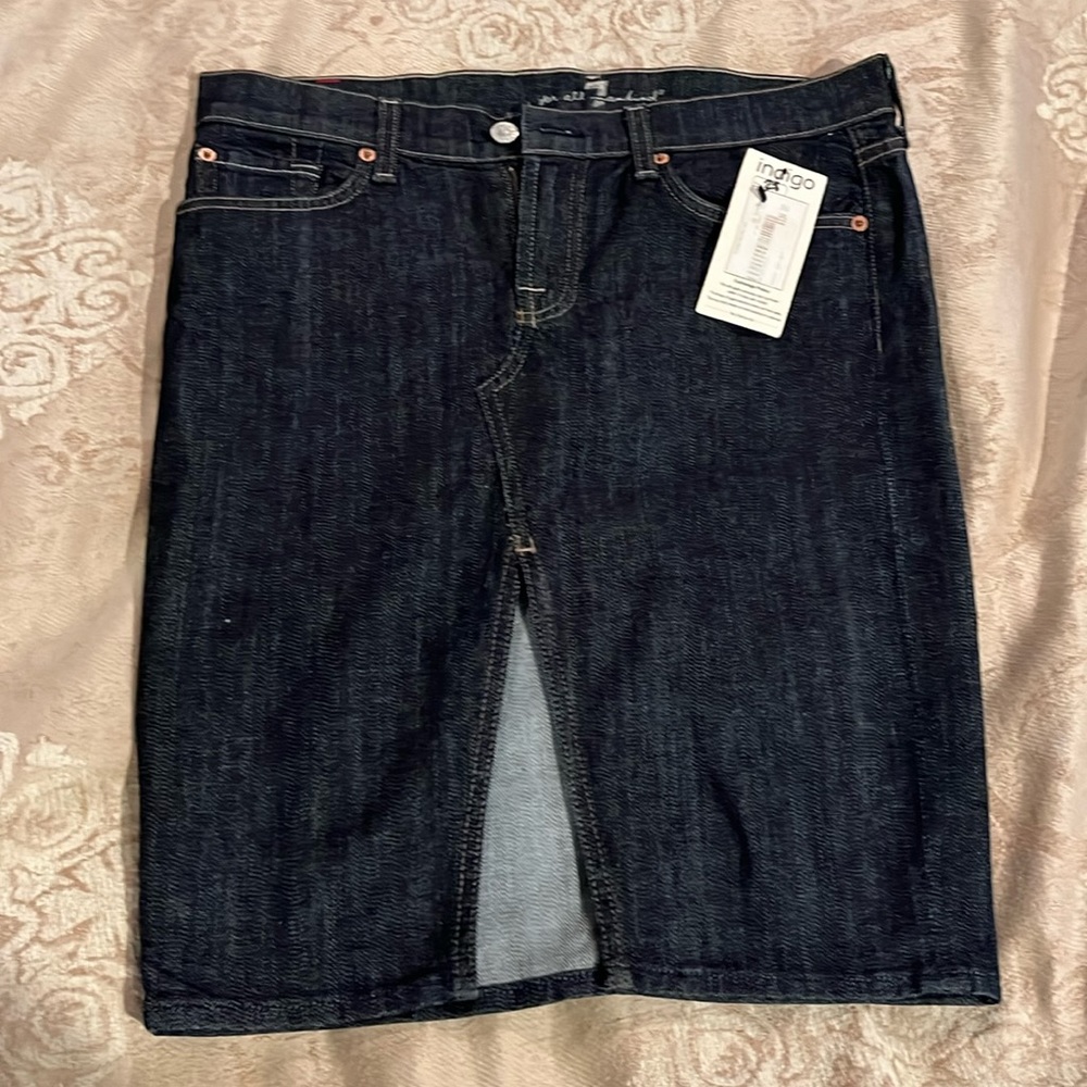 Denim jeans skirt with front slit. NWT size 28